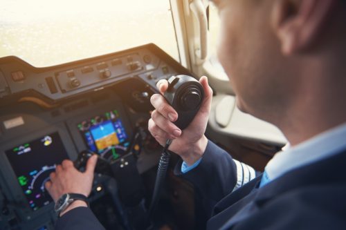 pilot talking on his radio