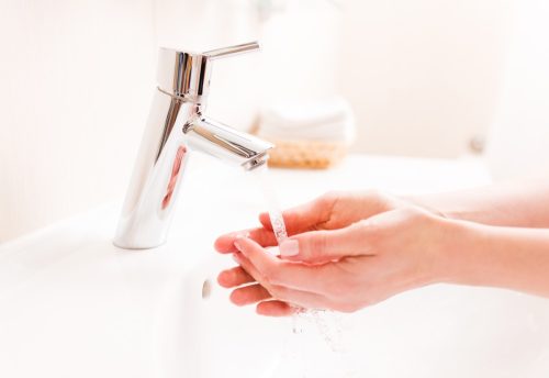 woman washing her hands