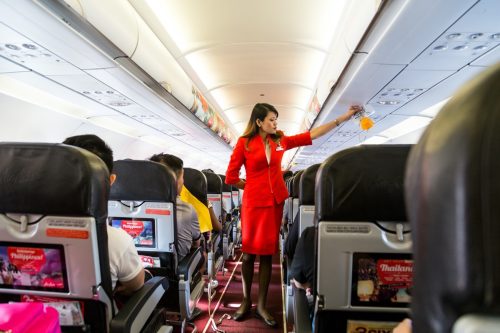 flight attendant doing the safety prep