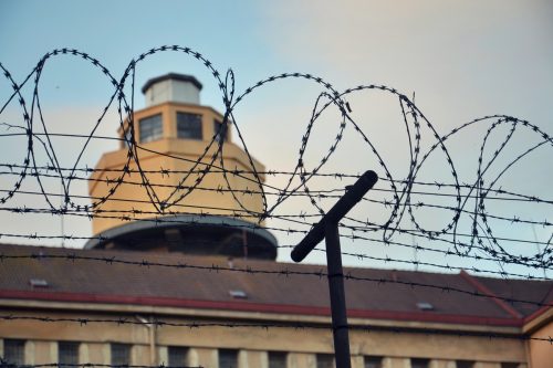 barbed wire around prison walls