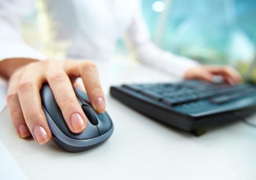 Woman using computer mouse