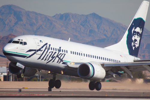 An Alaska Airlines plane landing at an airport