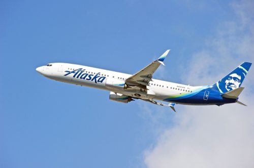 Alaska Airlines Boeing 737-900(ER) aircraft is airborne as it departs Los Angeles International Airport. Los Angeles, California USA