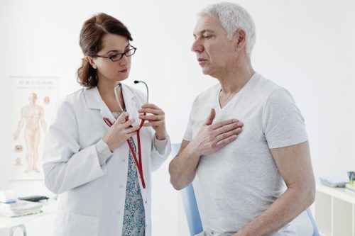 female doctor consulting male patient on heart concern