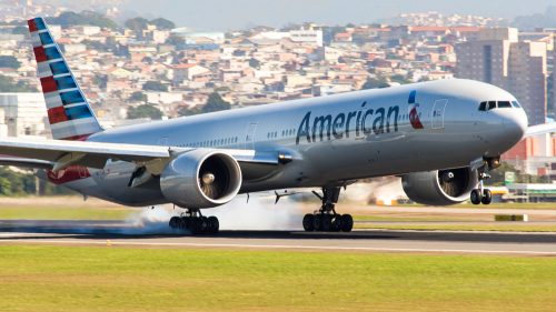 An American Airlines plane landing at an airport