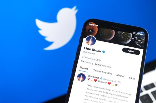 Elon Musk and Twitter logo background.