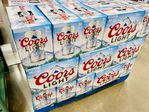 Large 36 packs of Coors Light beer cases on a pallet at warehouse.