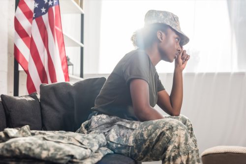 female soldier sitting on sofa