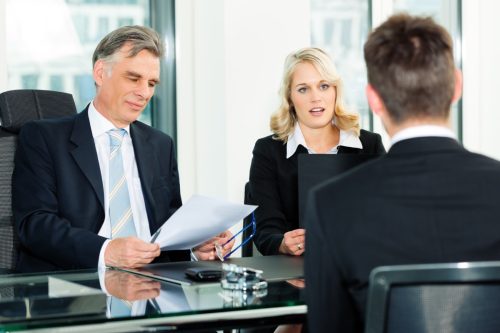 Business - young man sitting in job Interview