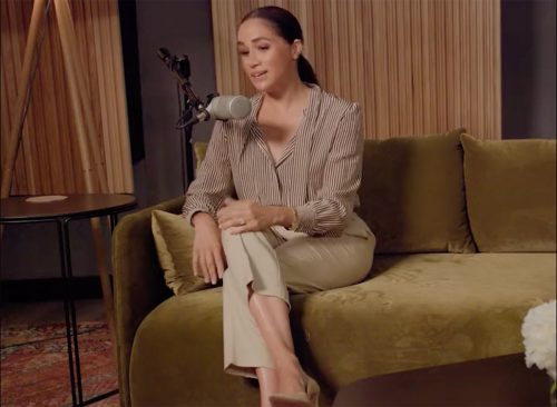 Meghan Markle speaking to a microphone.