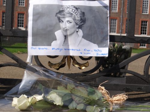 People pay tribute to Princess Diana for 21st anniversary of her death at Golden Gates of Kensington Palace, London, UK.