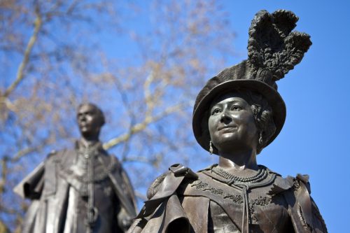 Statues of Elizabeth The Queen Mother and King George VI situated in Carlton Gardens, near The Mall in London.