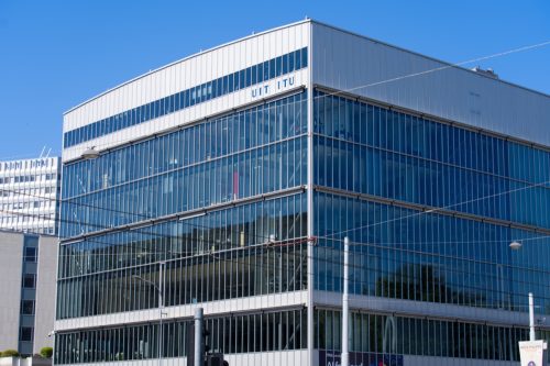 Skyscraper of International Telecommunication Union (ITU) at City of Geneva on a sunny summer day.