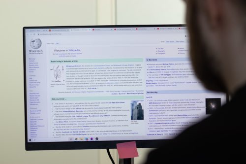 Man using Wikipedia on his computer.