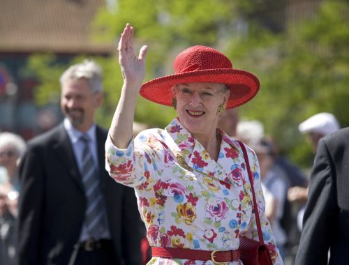 Queen Margrethe the 2nd of Denmark waves to the crowds.