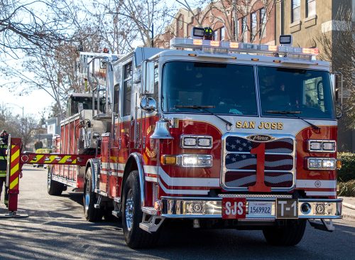 Bikini-Clad Woman in High Heels Exits Fire Truck and Enters Strip Club