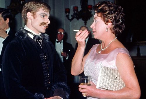 Princess Margaret (R) speaks to Royal Ballet dancer David Wall in 1978 during a Covent Garden Opera House after the premiere of the ballet, "Mayerling."