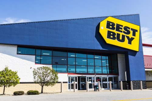 Exterior view of a Best Buy store on a sunny day.