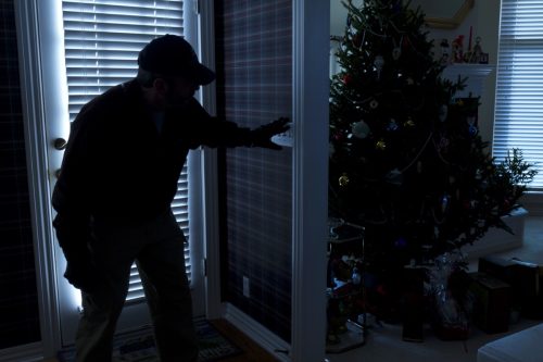 thief breaking in during the holidays