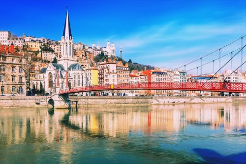 Pedestrian Saint Georges footbridge and the Saint Georges church in Lyon, France.