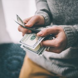 Person counting cash money