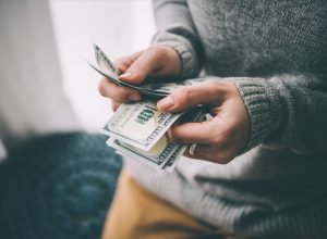 Person counting cash money