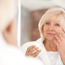 woman doing face exercises