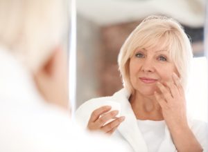woman doing face exercises