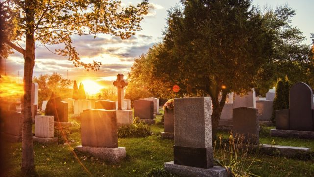 a cemetery during sunrise