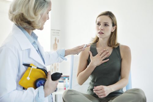 Woman at the doctor being treated for asthma