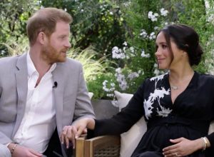 Harry and Meghan clench hands while talking about the Queen during Oprah interview on CBS on Mar. 7