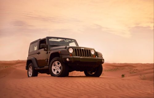 A green Jeep Wrangler