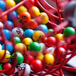 Lottery drawing with different colored balls with numbers.