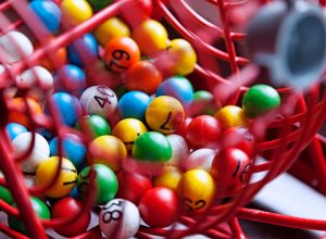 Lottery drawing with different colored balls with numbers.