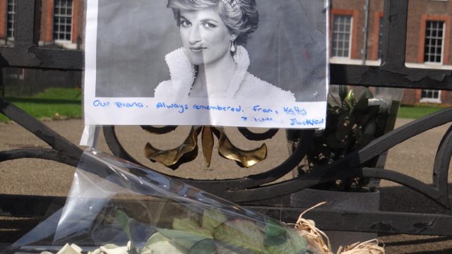 People pay tribute to Princess Diana for 21st anniversary of her death at Golden Gates of Kensington Palace, London, UK.