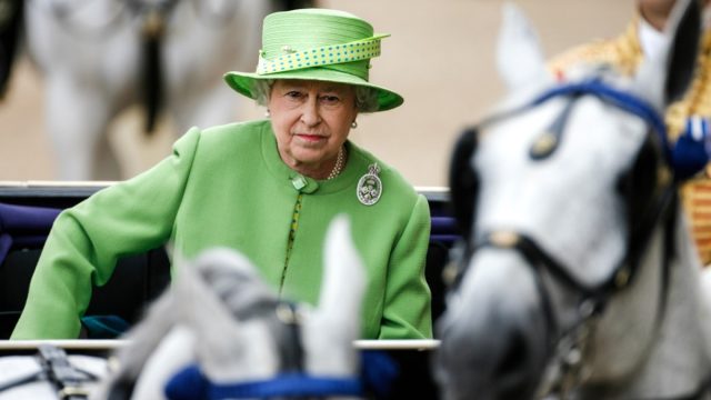 Her Royal Highness Queen Elizabeth II travels by carriage during the Trooping the Colour ceremony.