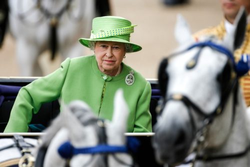 Her Royal Highness Queen Elizabeth II travels by carriage during the Trooping the Colour ceremony.