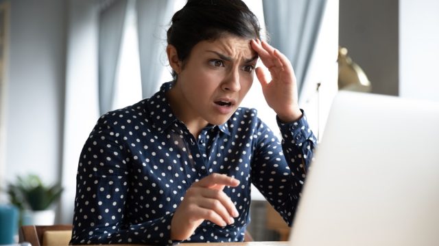 Shocked,Afraid,Worried,Young,Indian,Girl,Look,At,Laptop,Computer