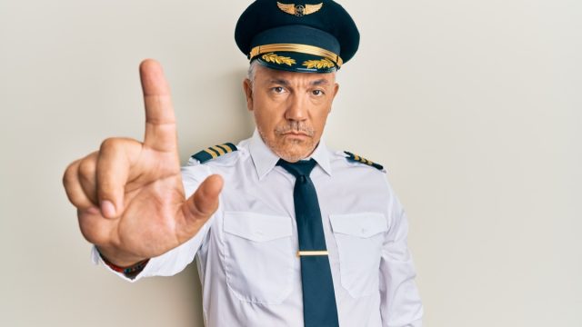 Handsome,Middle,Age,Mature,Man,Wearing,Airplane,Pilot,Uniform,Pointing, angry, mad