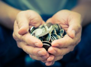 Coins in hands.