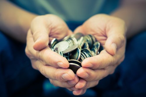 Coins in hands.