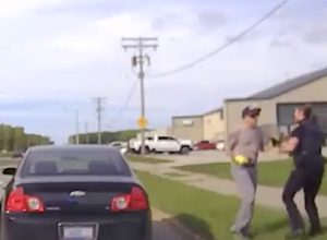 Video Shows Heroes Come to Rescue of Female Cop Attacked by Suspect During Traffic Stop