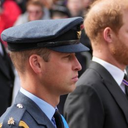 Prince William, and Prince Harry follow the coffin of Queen Elizabeth II as it is pulled on a gun carriage through the streets of London following her funeral service at Westminster Abbey in central London Monday