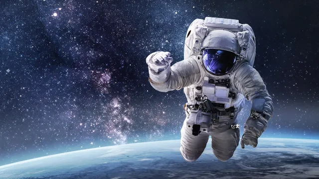 Astronaut,In,Outer,Space,Over,The,Planet,Earth.,Our,Home.