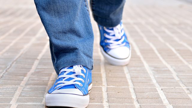 Close,Up,Of,Front,View,Of,A,Young,Walking,Along