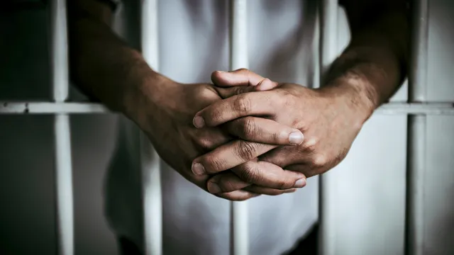 Hands,Of,Men,Desperate,To,Catch,The,Iron,Prison,prisoner,Concept,thailand