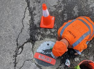 Rogue “Pothole Robin Hood” Fills Road Cavities With Mosaic Art