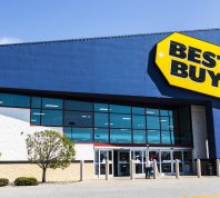 Exterior view of a Best Buy store on a sunny day.