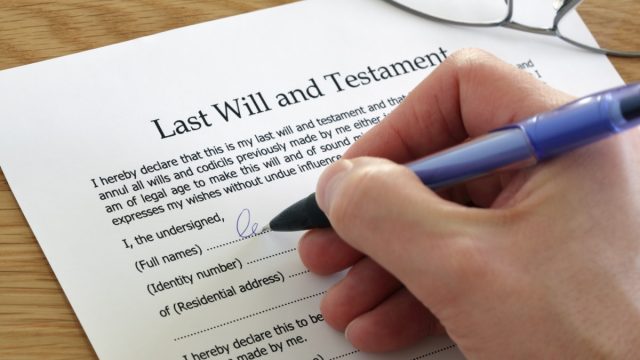 Signing Last Will and Testament document