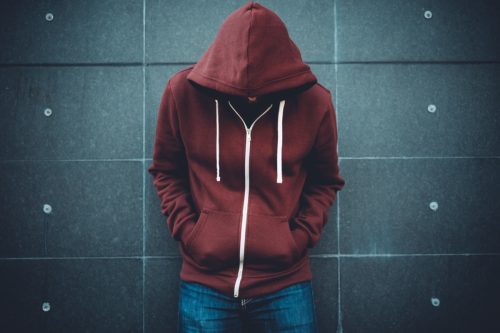 Lonely Man Leaning against an urban wall